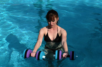 Lady with Foam Dumbbells in Pool Lady with Foam Dumbbells in Pool